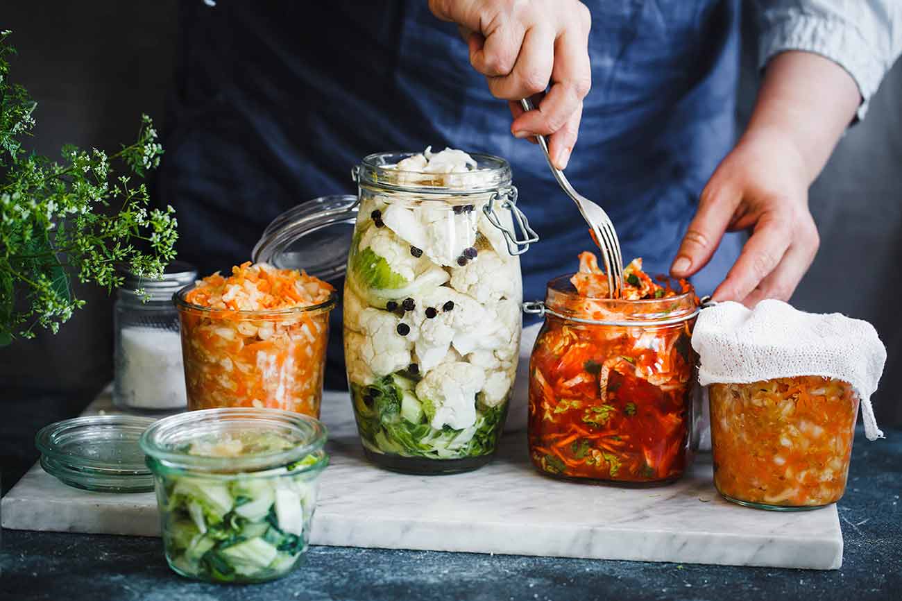 Fermented foods in glass jars which are great for gut health